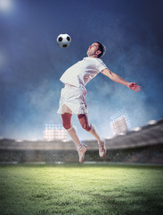Acrylglasbilder Fußball fürs Kinderzimmer Fußballer schießt Ball mit Wucht  © Sergey Nivens