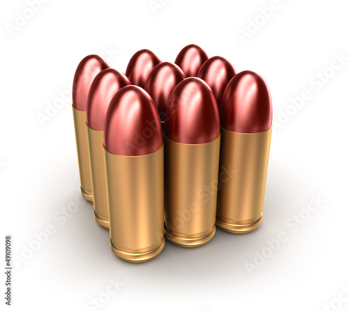 Pack of ammo catridges with bullets over white. photo