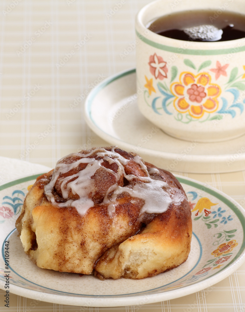 Cinnamon Roll and cup of Coffee Cinnamon Roll and cup of Coffee