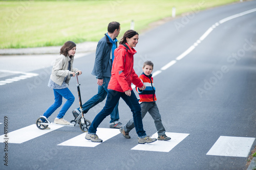 Vászonkép Family walk at the Crosswalk