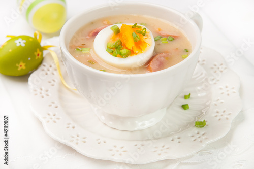 White borscht with eggs and white sausage.Polish easter soup