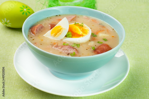 White borscht with eggs and white sausage.Polish easter soup