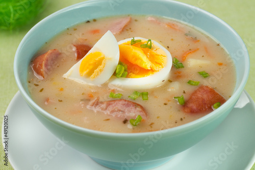 White borscht with eggs and white sausage.Polish easter soup