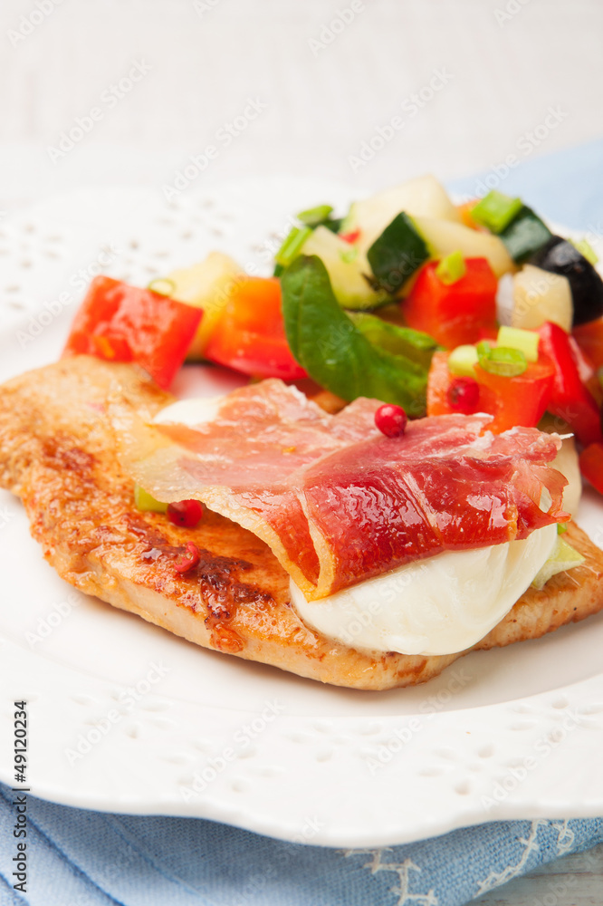 chicken fillet baked with mozzarella, Parma ham and vegetables chicken fillet baked with mozzarella, Parma ham and vegetables