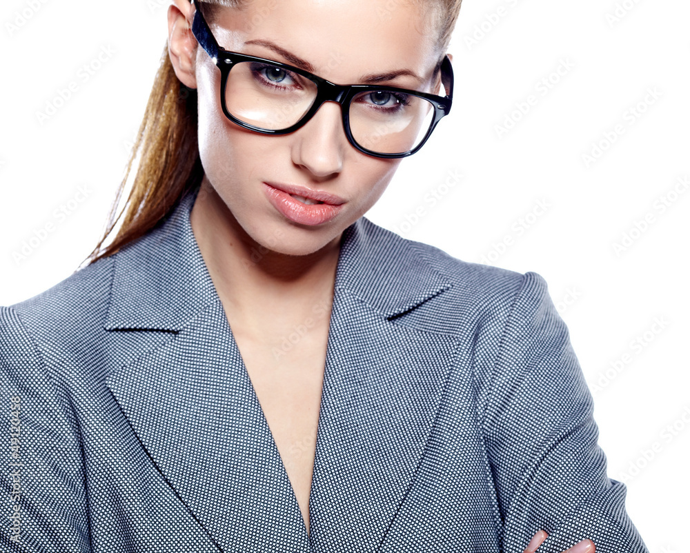 Attractive young business woman wearing glasses against white ba