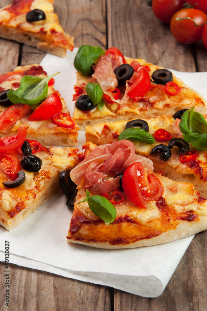 Pizza with ham, pepper and olives on old wooden background - obrazy, fototapety, plakaty 