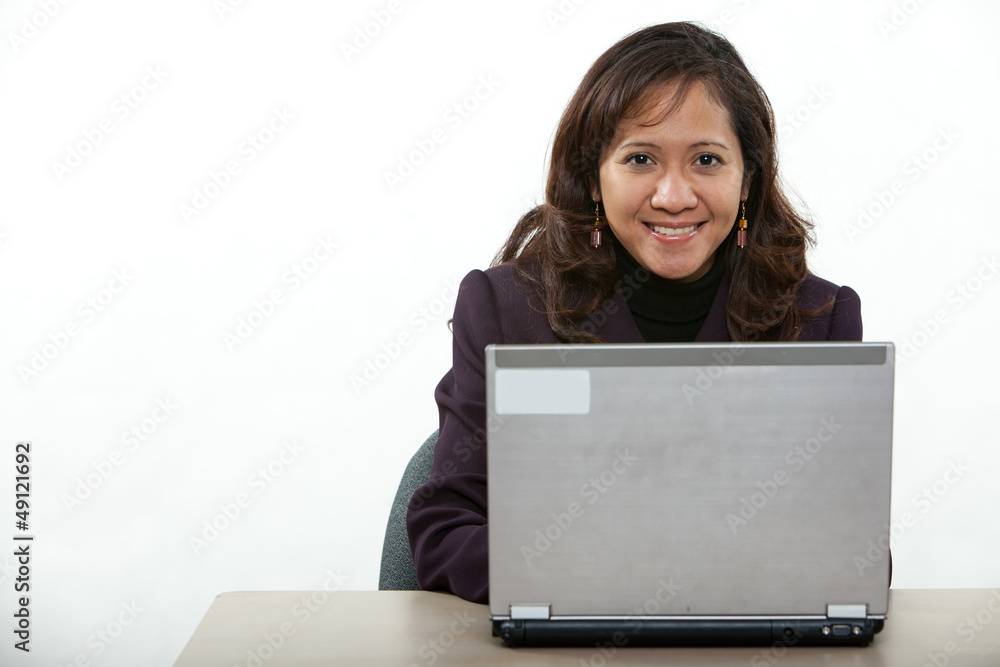 Attractive asian american businesswoman on computer Attractive asian american businesswoman on computer