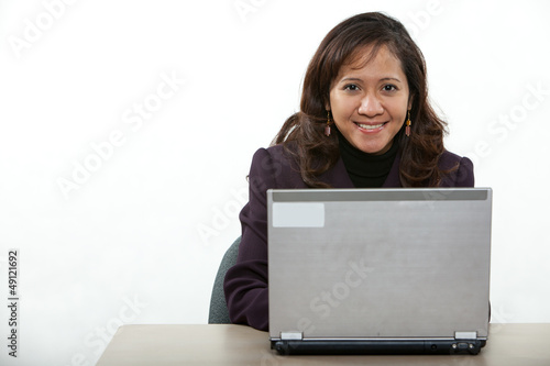 Attractive asian american businesswoman on computer