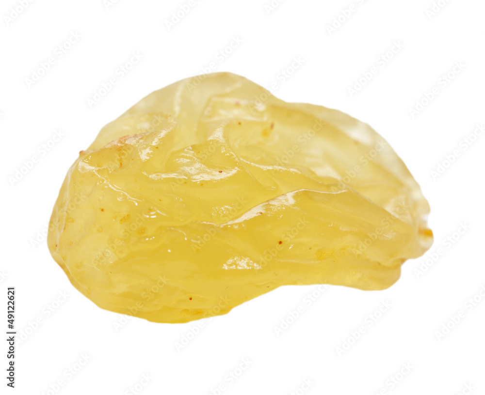 yellow raisins on a white background. macro yellow raisins on a white background. macro