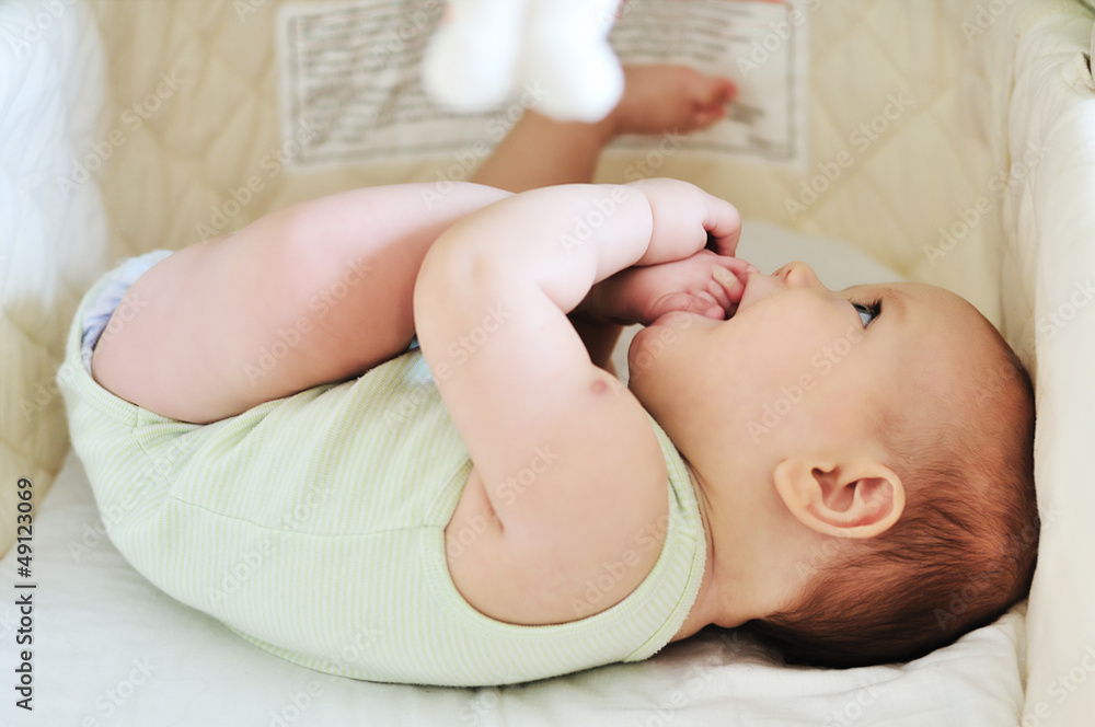 baby with feet in mouth baby with feet in mouth