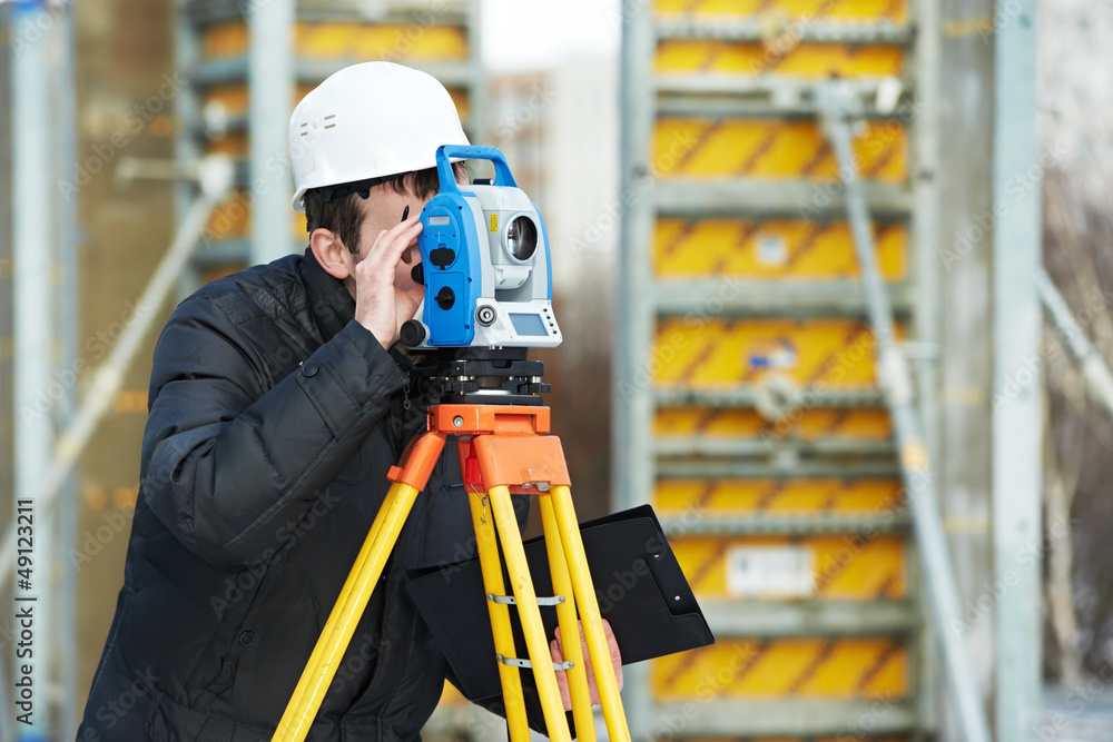 surveyor works with theodolite surveyor works with theodolite