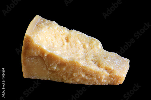 Food ingredients: parmesan cheese isolated on black background