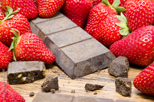 strawberries raw chocolate on whooden table photo