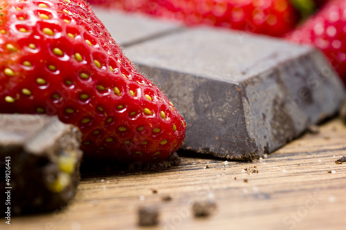 strawberries raw chocolate on whooden table photo