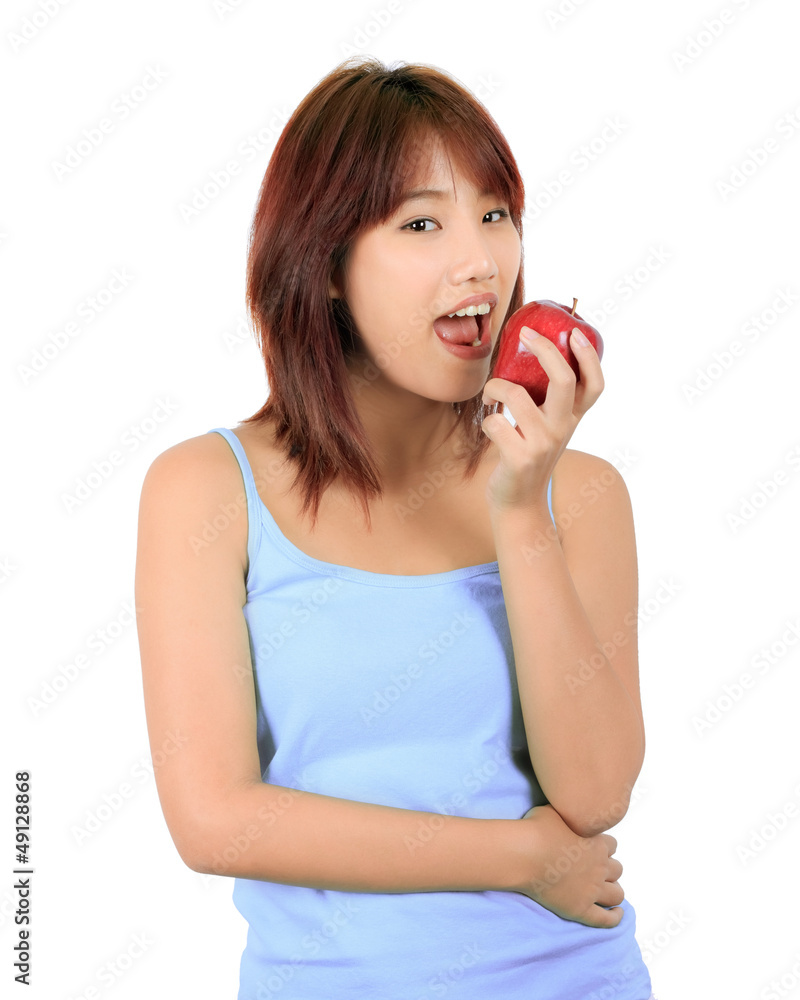 Isolated young asian woman with a red apple. Isolated young asian woman with a red apple.