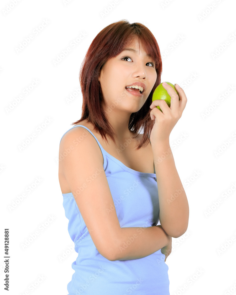 Isolated young asian woman with a green apple. Isolated young asian woman with a green apple.