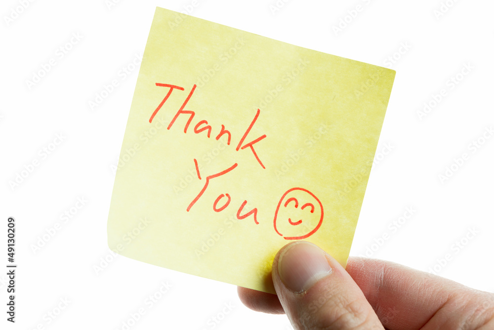 hand showing a post-it to thank you hand showing a post-it to thank you
