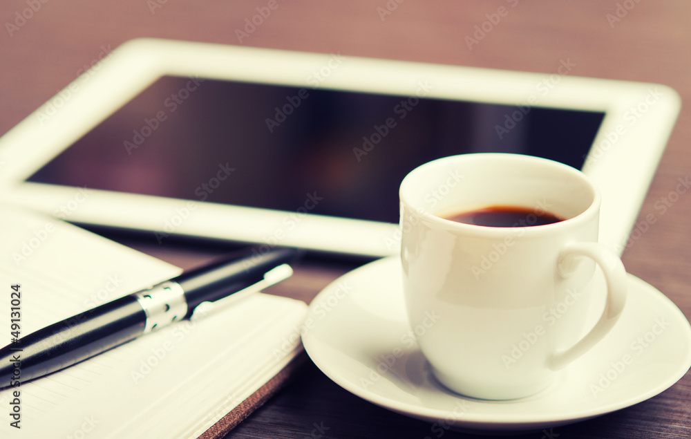 workplace, office desk: coffee and tablet pc and notebook with p workplace, office desk: coffee and tablet pc and notebook with p