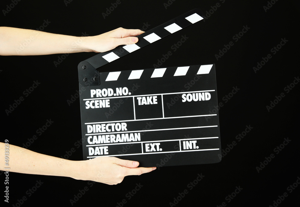 Movie production clapper board isolated on black