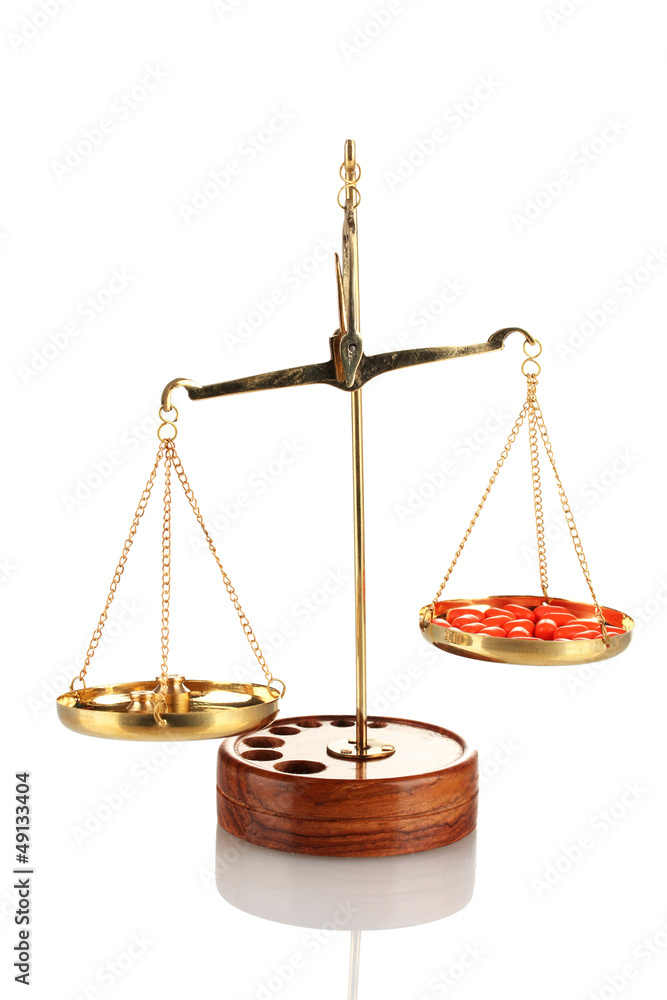 Classic scales with color pills isolated on white Classic scales with color pills isolated on white