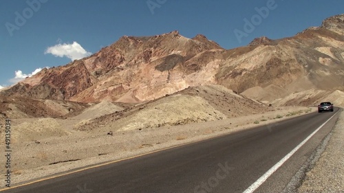 Sport car on Artists Drive road at Death Valley NP. USA.