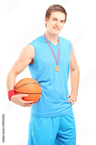 Winner basketball player posing with a golden medal © Ljupco Smokovski