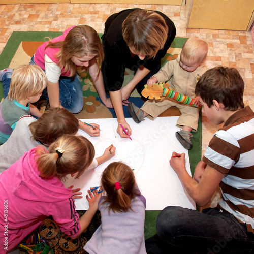 Big happy family drawing a heart together