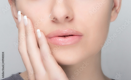 Natural Makeup and French Manicure. Sensual Lips