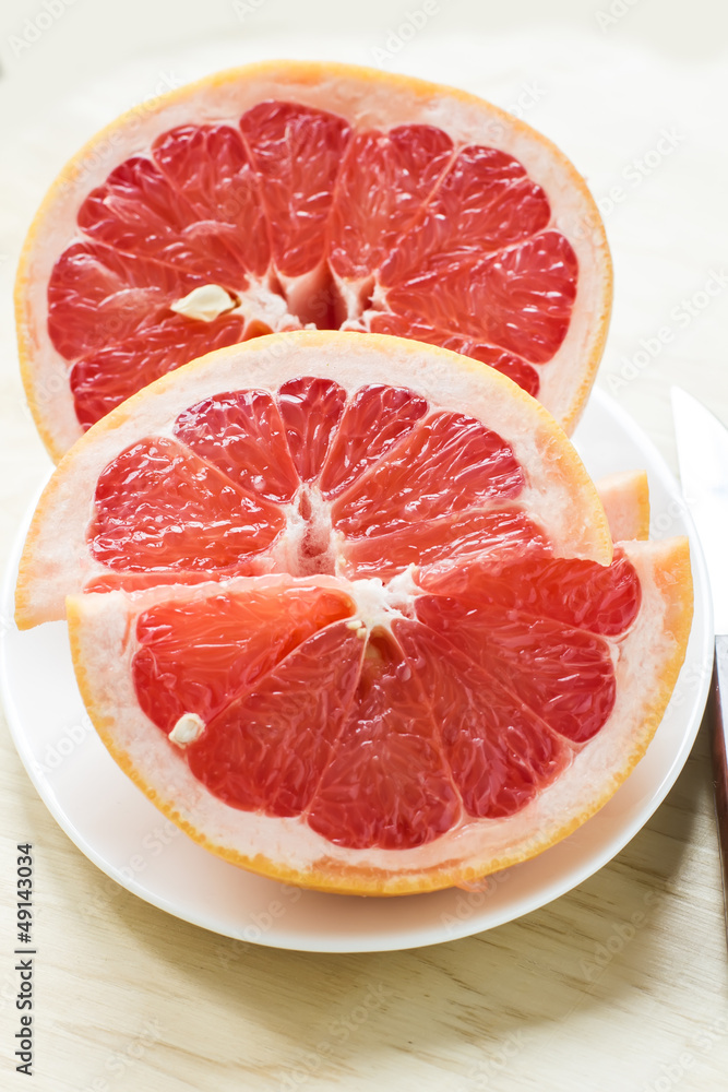 Fresh grapefruit on plate Fresh grapefruit on plate