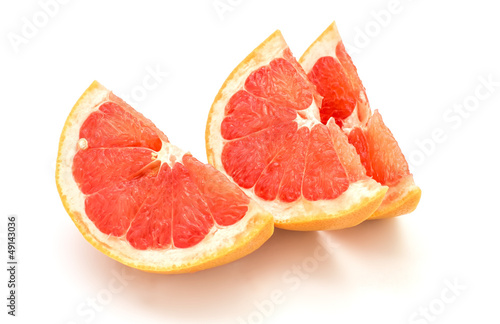 Slices of grapefruit isolated on white