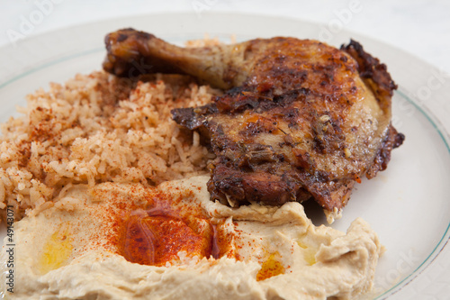 Dinner of saffron rice, roasted chicken and hummus