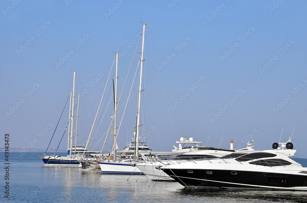 White motor yacht over harbor pier, Odessa, Ukraine