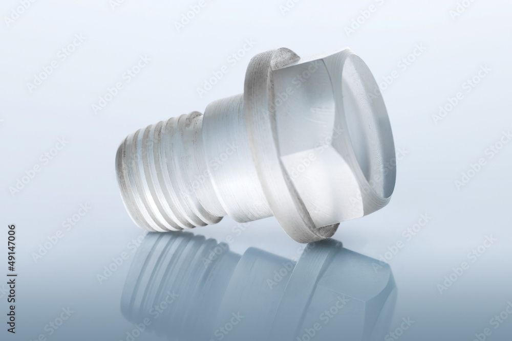 Unusual Bolt made of transparent plastic on blue Unusual Bolt made of transparent plastic on blue