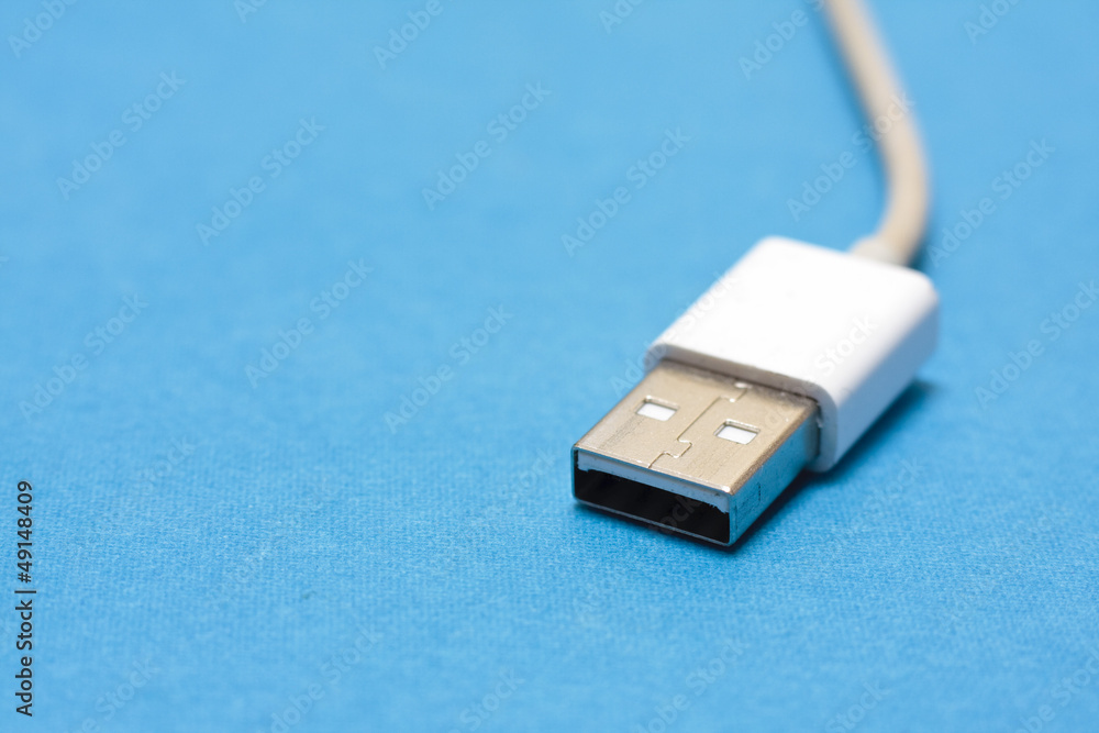 USB cable on a blue background USB cable on a blue background