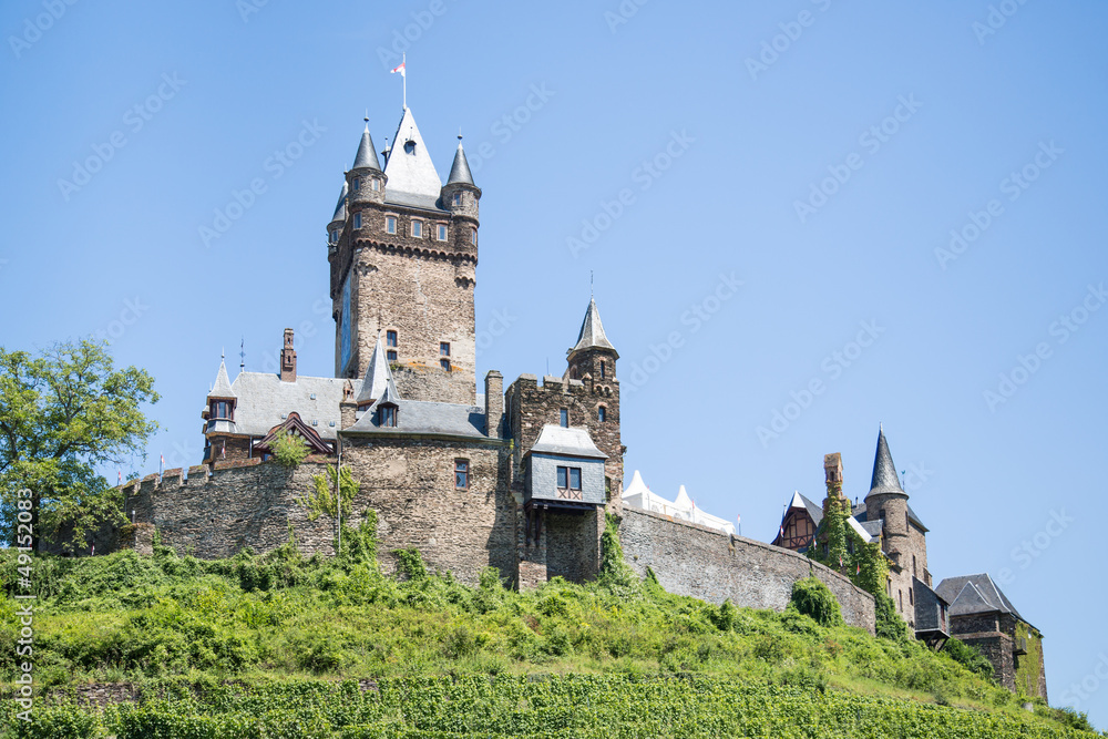 Cochem castle in Germany, surrounded by vineyards