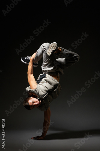 hip-hop dancer standing on one hand © ArtFamily