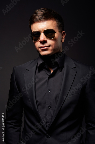 handsome young adult man in sunglasses