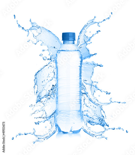 Fresh water splashing out of bottle