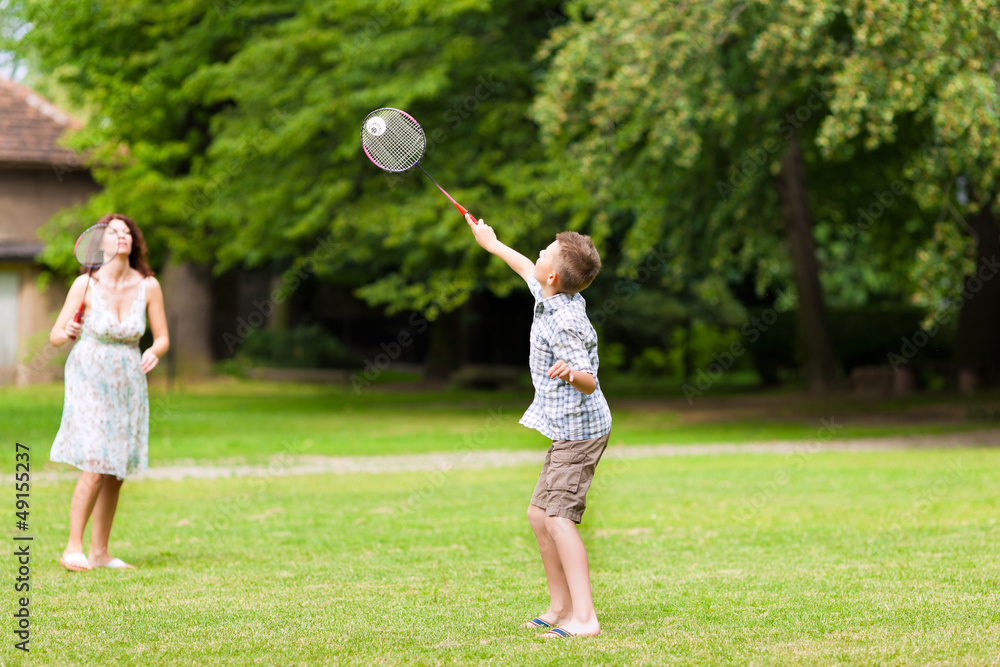 Family is playing in summer in their garden Family is playing in summer in their garden