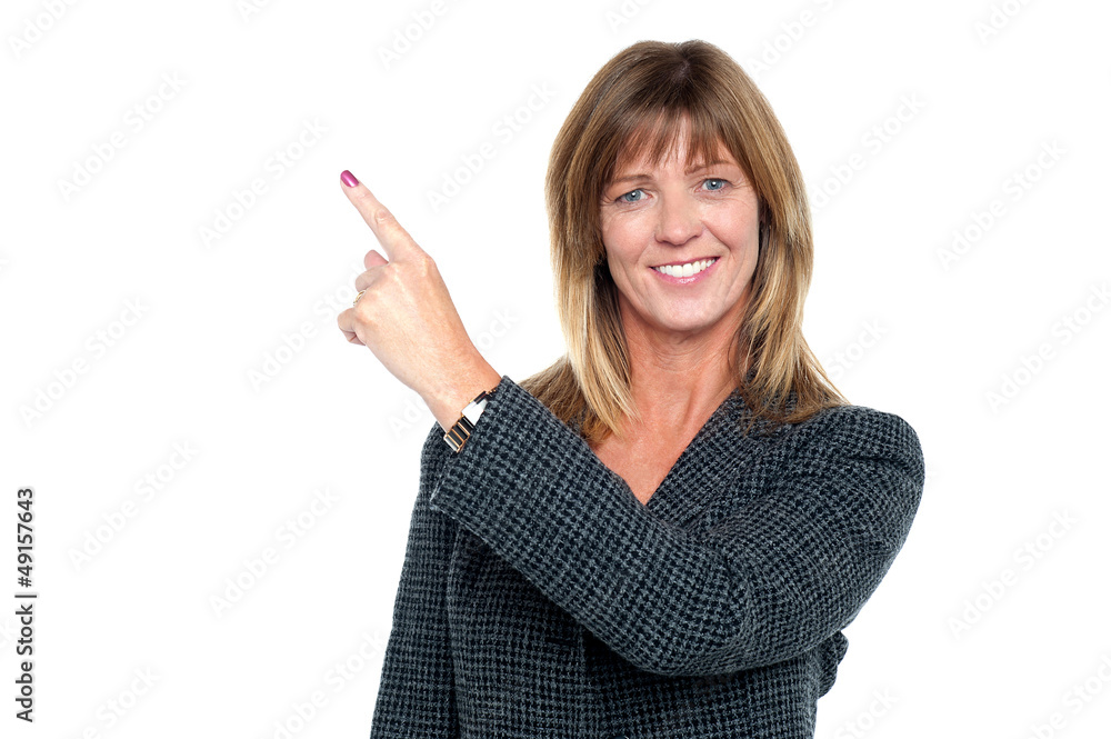 Confident corporate lady pointing away Confident corporate lady pointing away