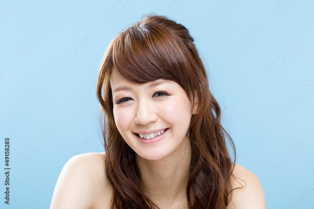 Beautiful asian woman on blue background Beautiful asian woman on blue background