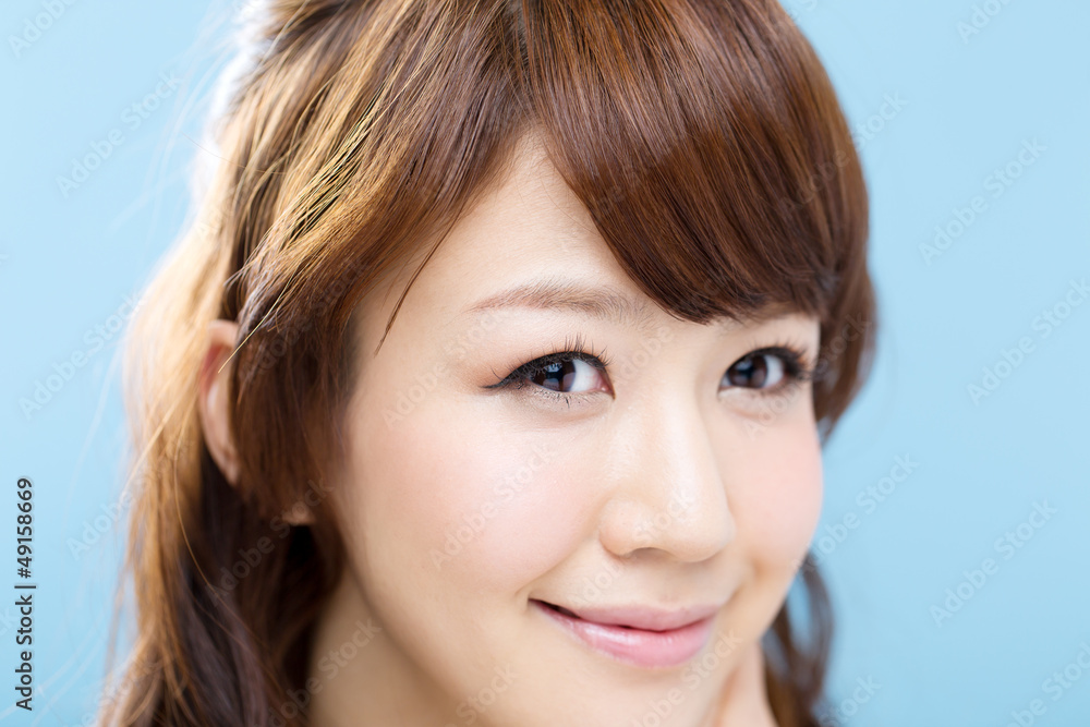 Beautiful asian woman on blue background