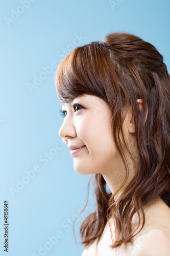 Beautiful asian woman on blue background