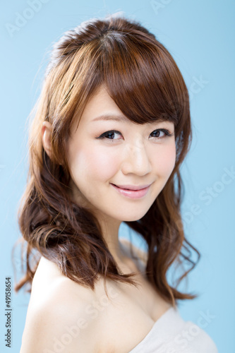 Beautiful asian woman on blue background