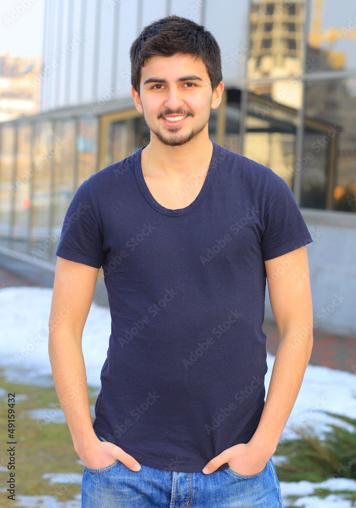 A handsome young man in plain clothes. A handsome young man in plain clothes.