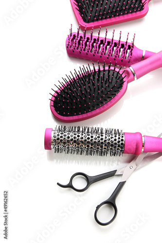 Comb brushes and Hair cutting shears  isolated on white