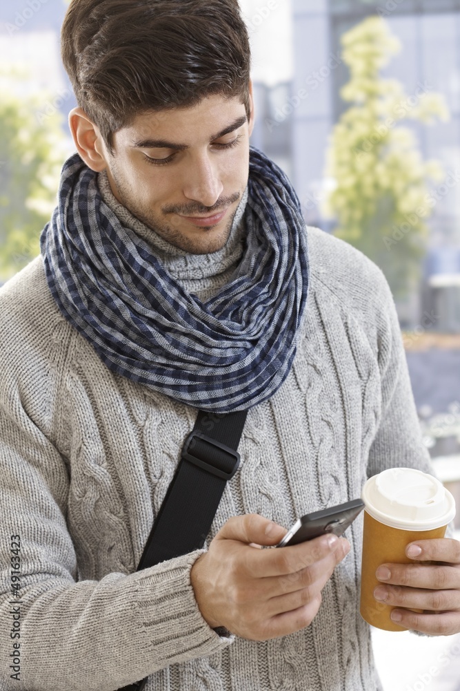 Young man using mobile outdoors Young man using mobile outdoors