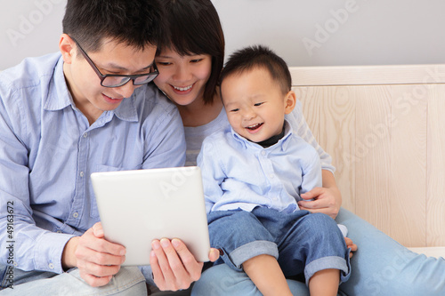 happy family using tablet pc