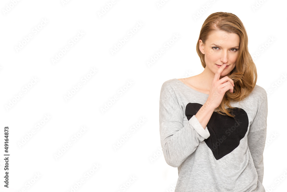 A woman whispering and watching suspiciously with her finger A woman whispering and watching suspiciously with her finger