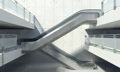 Moving escalator and modern office building photo